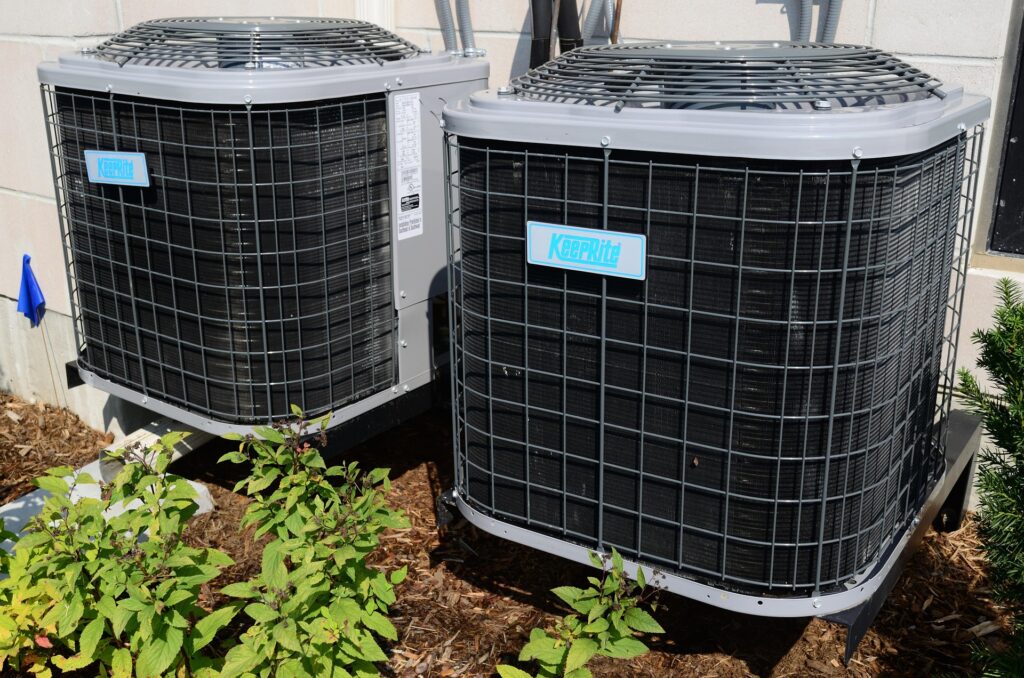 Side by side AC units after and AC repair