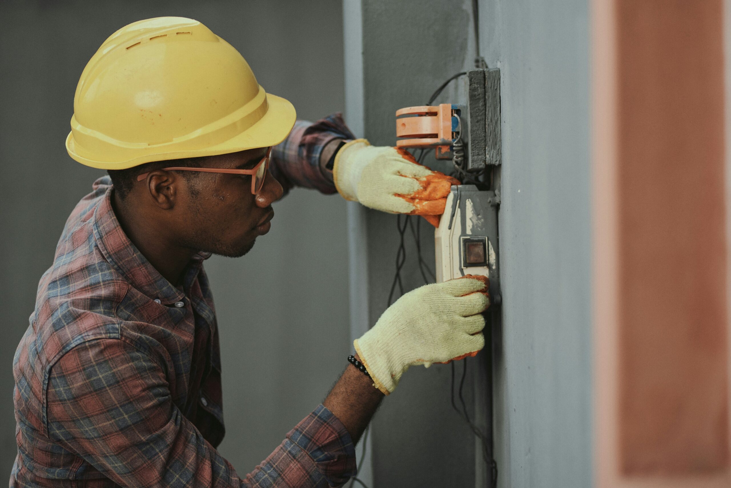 AC technician looking for signs of repair needed